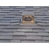 A roof vent is obstructed with debris, preventing air flow. 