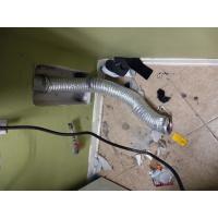 A large amount of lint and debris comes out of a vent pipe.